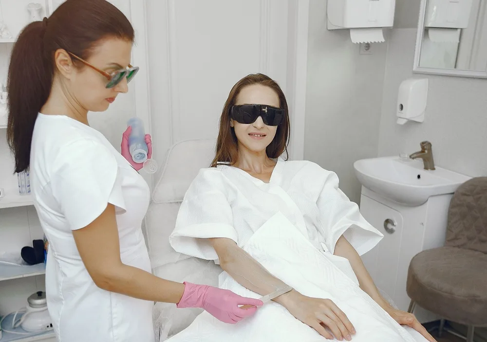 Doctor applying gel for laser hair removal