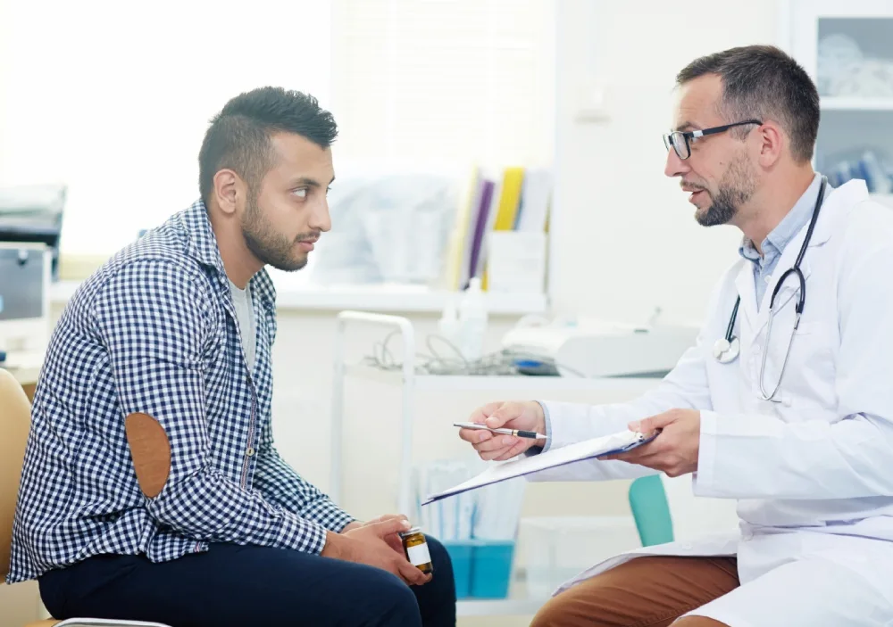 Young man with doctor for consultation about hair prp